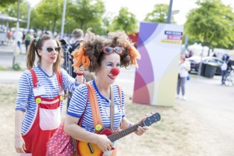 Two clowns at the citizens' festival celebrating democracy. / The Basic Law turns 75, together it