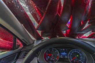 Car in an automatic car wash, car wash tunnel