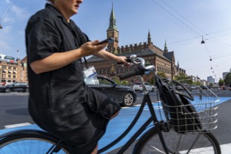 Cyclists on cycle paths, Radhuspladsen, City Hall Square, in the city centre of Copenhagen,