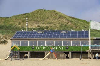 Solar modules on roofs, on the roof of a beach restaurant in Zeeland, near Koudekerke, Netherlands