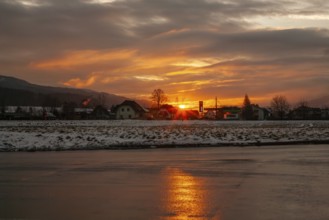 Sunset reflected in the asphalt of a car park, near Krieglach, Styria, Austria, Europe