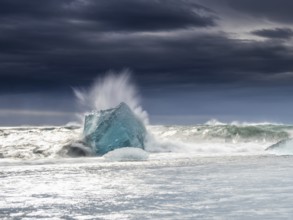 Diamond Beach, iceberg in the surf, near Jökulsarlon glacier lagoon, Vatnajökull National Park,