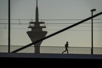 Jogger on the Oberkassler Rhine Bridge, Rhine Tower, Düsseldorf, North Rhine-Westphalia, Germany,