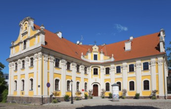 Historic baroque building with yellow façade and red tiled roof, Poznan Sródka, Former Philippine