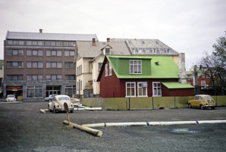 Contrast between historic buildings made of corrugated iron and modern buildings, Reykjavík,