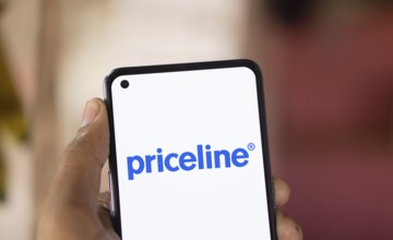 priceline logo is displayed on smartphone. is an online travel agency for discount for travel