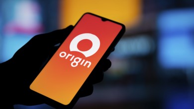 Origin Energy logo is displayed on smartphone. Origin Energy Ltd is an Australian energy company