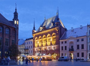 The Areszt sledczy in the medieval old town of Thorn, illuminated in the evening. The historic city