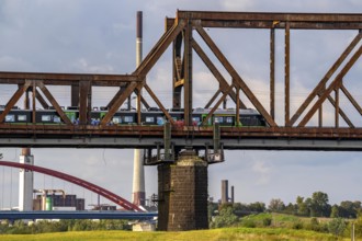 The railway bridge Duisburg-Hochfeld-Rheinhausen, over the Rhine, regional trains and many goods