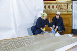 Hanging of the last tapestries in the Royal Parade Rooms in the Dresden Residenzschloss, Dresden,