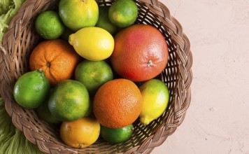 Assortment, citrus fruits, in a basket, close-up, top view, no people