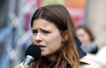 Luisa Neubauer speaks during a demonstration by Fridays for Future for compliance with climate