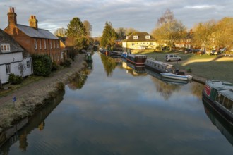 Narrow boats moored on Kennet and Avon canal in town centre of Hungerford, Berkshire, England, UK