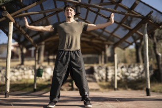 A man practices Yi Jin Jing, a Buddhist Chinese training method known as Changing Muscles and