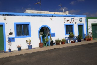 Traditional architecture pretty house painted blue and white, Las Salinas del Carmen,