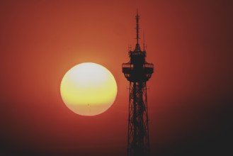 The sun rises behind the radio tower in Berlin, 04/09/2024