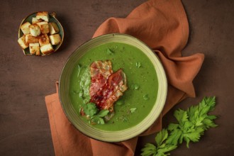 Green mashed soup, with bacon and croutons, homemade, no people