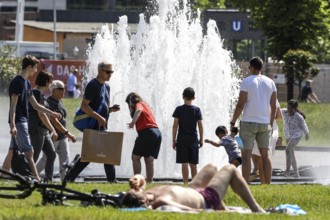 People enjoying the summer weather at Berlin's Lustgarten, 05/06/2021