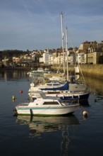 Boats in the harbour and the town of St Peter Port, Guernsey, Channel Islands, UK, Europe