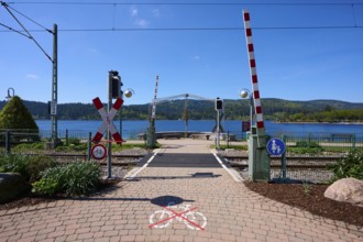 Railway crossing at Schluchsee and blue sky, embedded in a mountain landscape, Schluchsee, Black