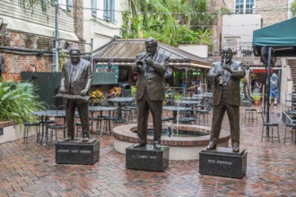 Statues of music legends Fats Domino, Al Hirt and Pete Fountain in the French Quarter of New