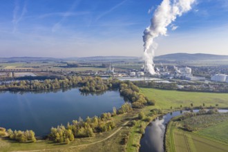 Drone shot of river Leine with Nordzucker sugar factory in Nordstemmen, smoking chimneys on a cold