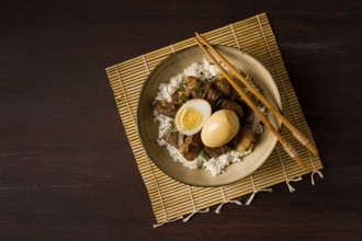 Stewed eggs, with pork belly, and rice, chinese food, homemade, selective focus, rustic, no people