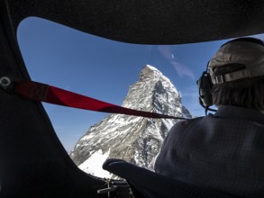 Flight in small aircraft in the swiss alps, view towards peak of Matterhorn, Switzerland, Europe