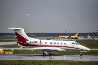 Private jet, Embraer Phenom 300 F-GXAE, on the western runway, Frankfurt am Main Airport, FRA,