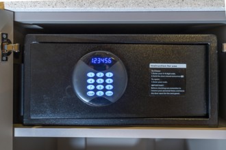 Room safe in a hotel, keypad for entering a 6-digit numerical code to lock the safe for depositing