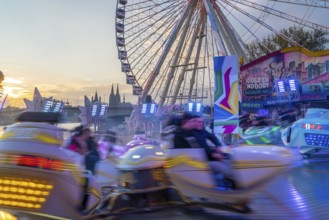 Deutz funfair on the Rhine, at Easter, funfair, break-dancer ride, Ferris wheel, Cologne Cathedral,