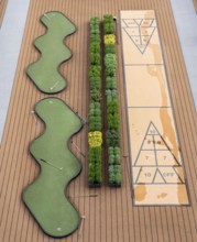 Outdoor deck, upper deck, open-air deck of a river cruise ship, putting green and shuffleboard game