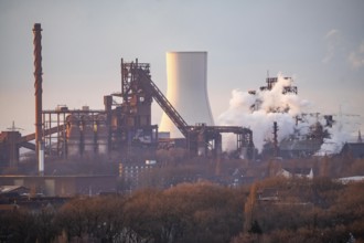 Skyline of the steel location Duisburg, Thyssenkrupp Steel Europe, in Duisburg-Bruckhausen, sunset,