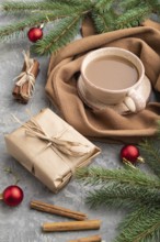 Christmas or New Year composition. Decorations, box, cinnamon, fir and spruce branches, cup of