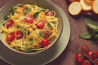 Yellow zucchini salad, with cherry, vegetarian food, sliced into strips, homemade