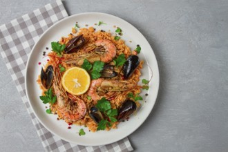 Seafood paella, shrimp and mussels risotto, rice, homemade, top view, no people