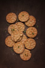 Crispbread, round, with salt and herbs, top view, food concept, no people