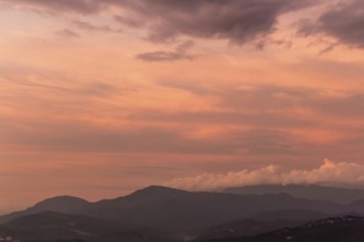 Dramatic purple sky over misty hills. Malaysia