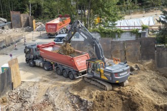 Construction work, excavating a building pit for a residential building