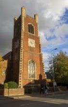 Red brick clock tower of parish church of Saint Paul, Hills Road, Cambridge, Cambridgeshire,