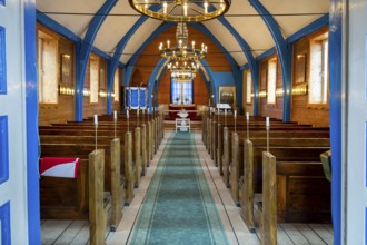 Church interior with several rows of wooden benches, church, Inuit settlement Ittoqqortoormiit,