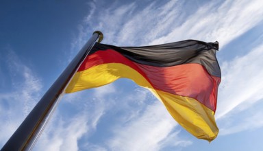 Flag, the national flag of Germany fluttering in the wind