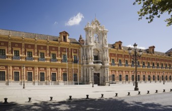 San Telmo palace building facade with columns at the entrance decorated with carved statues and