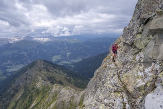 Hiker on the Carnic High Trail, ascent to the Raudenspitze, Carnic Main Ridge, Carnic Alps,