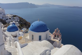 Santorini, Oia, blue domes, churches Agios Spyridon Agios Anastasis from above, Cyclades, Greece,