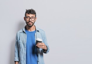 Portrait of young man with paper cup of coffee, A person with paper cup of coffee in isolated