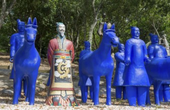 Blue terracotta soldiers and horse statues with a painted soldier in a forest, Bacalhôa, Bacalhoa