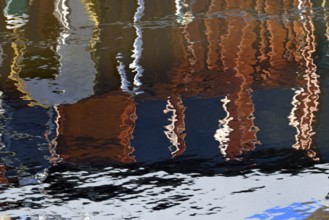 Reflection, colourful reflections on the water surface, maritime impressions, Greetsiel, North Sea,