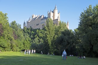 People in the park at the Alcázar of Segovia, Segovia Castle, medieval castle, city of Segovia,