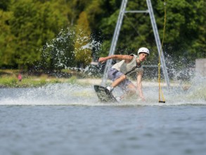 Young man on wakeboard falls in the water, Water ski and wake park, Water sports